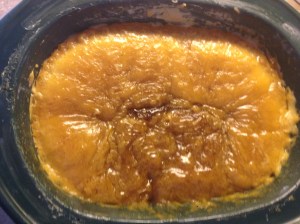 Here the soap has cooked for the first 30 minutes.  Take your stainless steel spoon and stir it very good.  Then just put the lid back on and check again in another 30 minutes.